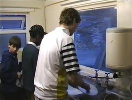 Washing up in the small hostel kitchen